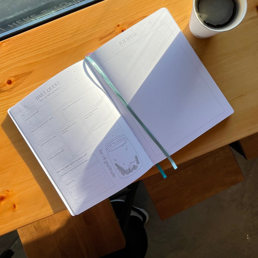 Healing Self-Discovery Journal with Coffee at bar